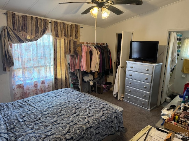 bedroom with carpet floors, vaulted ceiling, and a ceiling fan