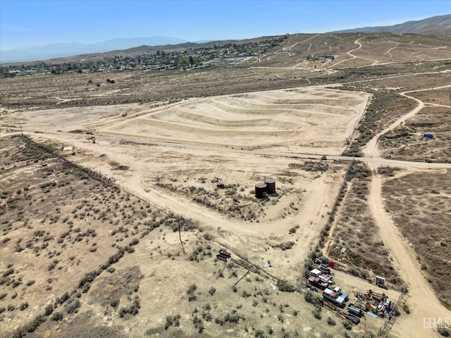 aerial view with a rural view, a mountain view, and a desert view
