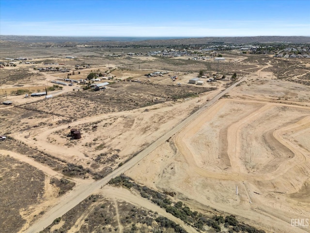 birds eye view of property with a rural view and view of desert