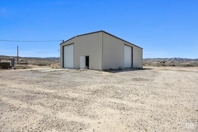 view of outbuilding featuring an outbuilding and a mountain view