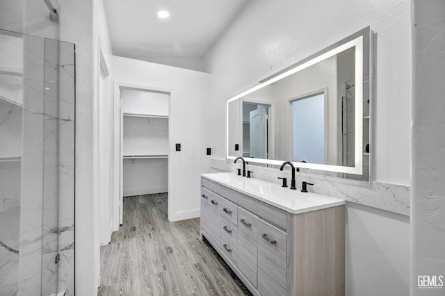 bathroom with hardwood / wood-style flooring and vanity