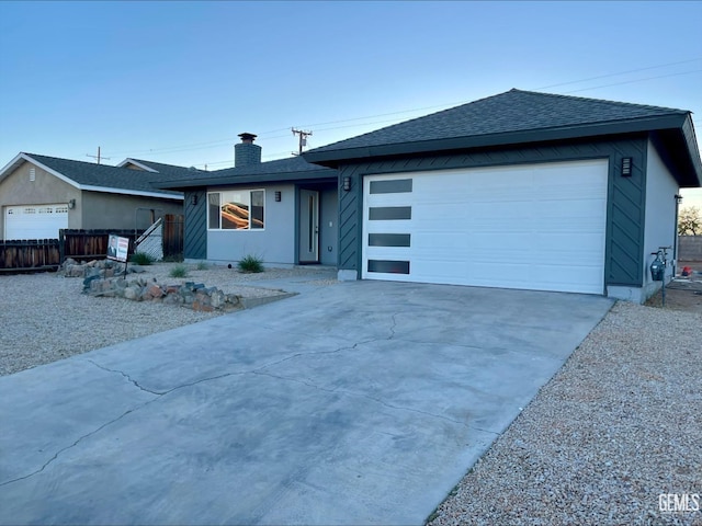 single story home with a garage