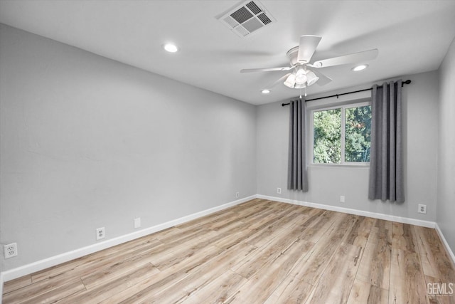 unfurnished room with ceiling fan and light wood-type flooring