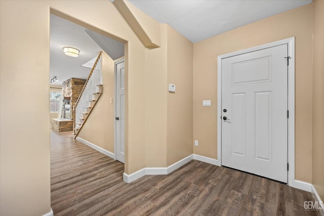 foyer with dark hardwood / wood-style floors