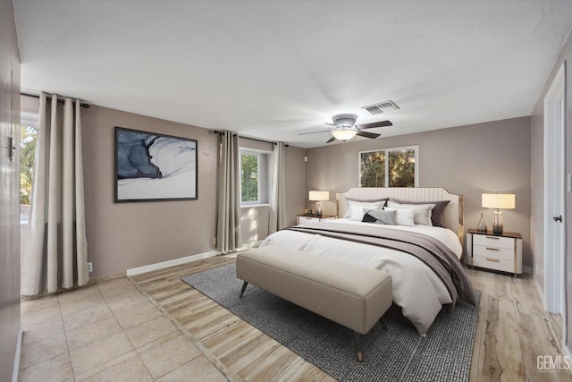 bedroom with ceiling fan and light hardwood / wood-style floors