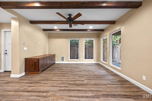 unfurnished room featuring wood-type flooring, ceiling fan, and beam ceiling