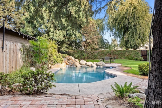 view of swimming pool with a patio area