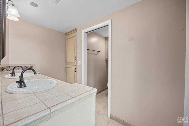 bathroom with tile patterned floors, toilet, and vanity