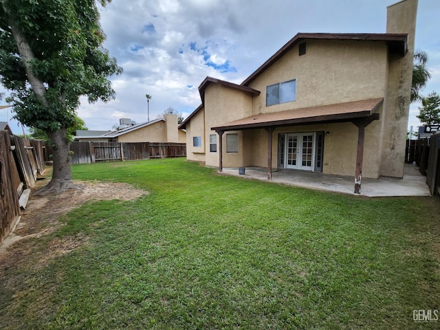 5913 El Camino Ave, Bakersfield, CA 93313 - back of house with french doors, a patio area, and stucco siding