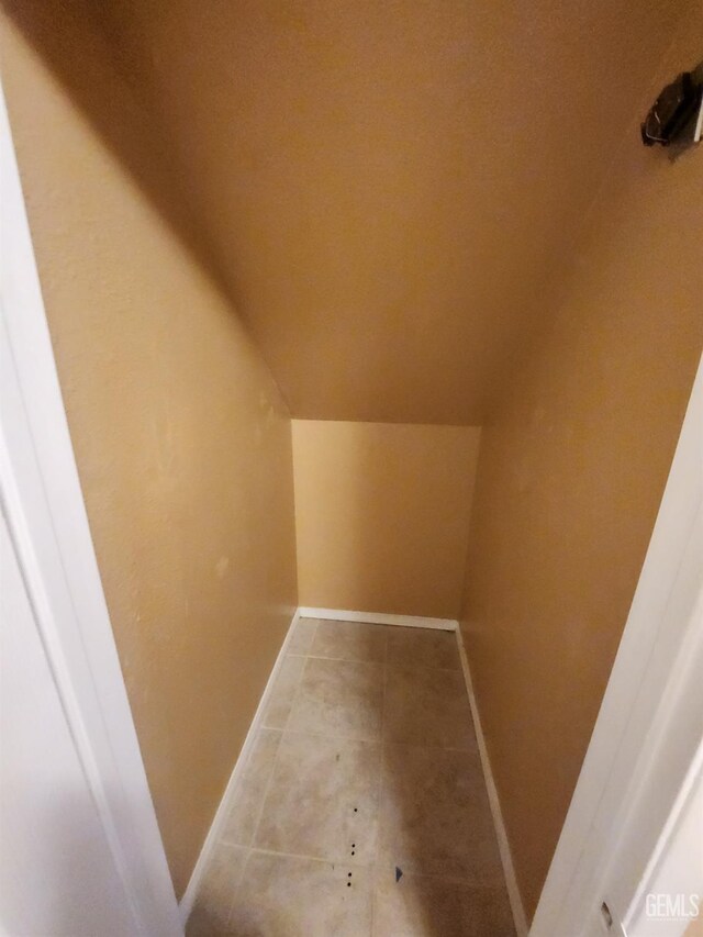 5913 El Camino Ave, Bakersfield, CA 93313 - additional living space featuring lofted ceiling, baseboards, and tile patterned floors