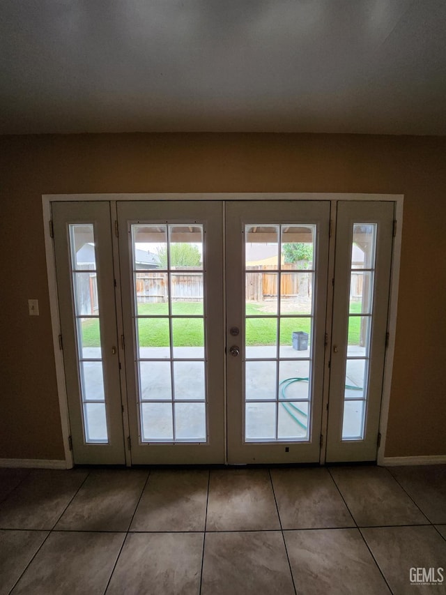 5913 El Camino Ave, Bakersfield, CA 93313 - doorway to outside with french doors, tile patterned flooring, and baseboards
