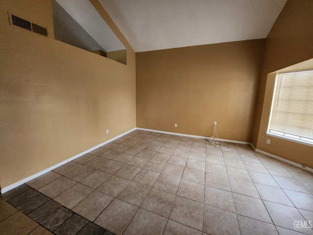 5913 El Camino Ave, Bakersfield, CA 93313 - unfurnished room featuring light tile patterned floors, baseboards, and high vaulted ceiling