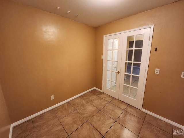 5913 El Camino Ave, Bakersfield, CA 93313 - doorway featuring french doors, light tile patterned flooring, and baseboards
