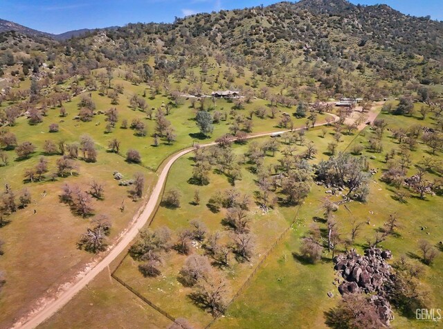 birds eye view of property with a mountain view