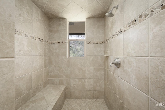 bathroom featuring tiled shower