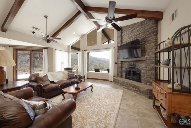 living room featuring visible vents, ceiling fan, and beamed ceiling