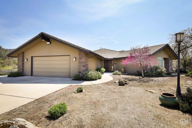 single story home featuring an attached garage, driveway, stone siding, and stucco siding