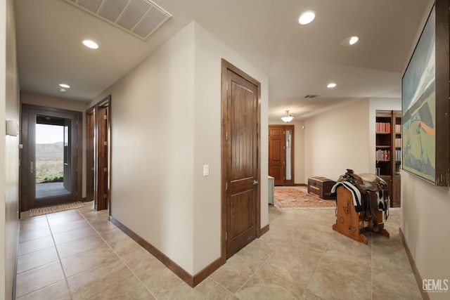 corridor featuring visible vents, recessed lighting, and baseboards