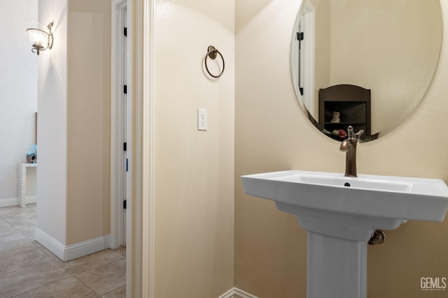 14822 Plumeria Ct, Bakersfield, CA 93314 - bathroom with a sink, baseboards, and tile patterned floors