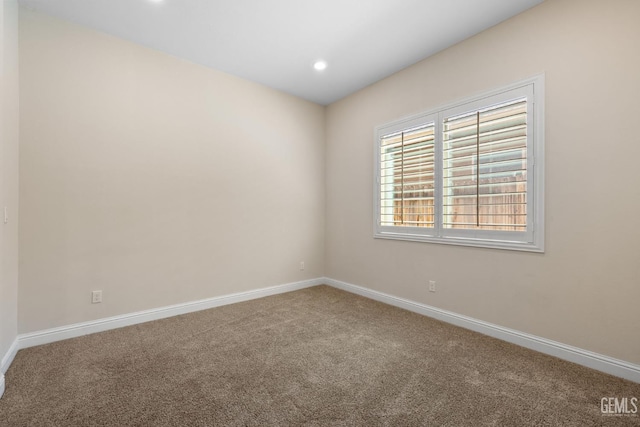 14822 Plumeria Ct, Bakersfield, CA 93314 - carpeted empty room with baseboards and recessed lighting