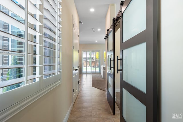 14822 Plumeria Ct, Bakersfield, CA 93314 - hall with baseboards, light tile patterned floors, a barn door, and recessed lighting