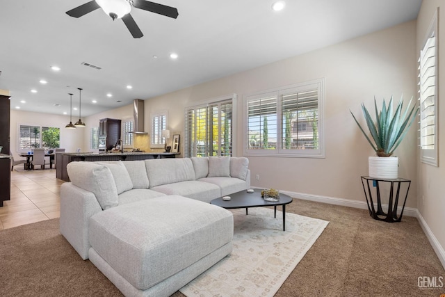14822 Plumeria Ct, Bakersfield, CA 93314 - living area with recessed lighting, light colored carpet, ceiling fan, and baseboards