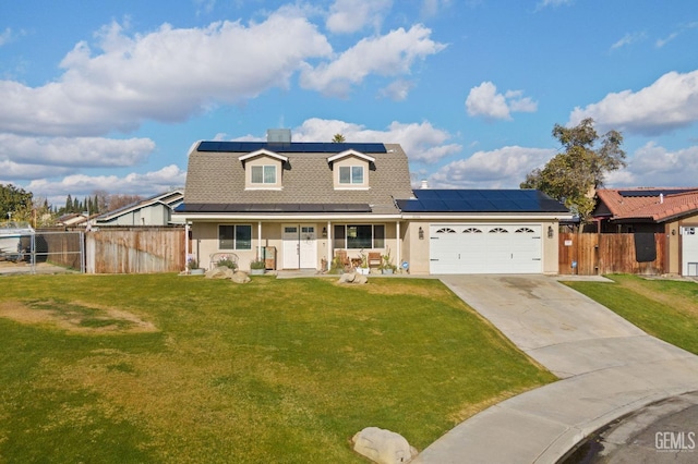 view of front of house featuring a garage, covered porch, a front lawn, and solar panels