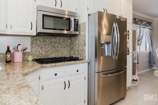 7116 Jolynn St, Bakersfield, CA 93308 - kitchen featuring appliances with stainless steel finishes, tasteful backsplash, light tile patterned floors, ornamental molding, and white cabinets