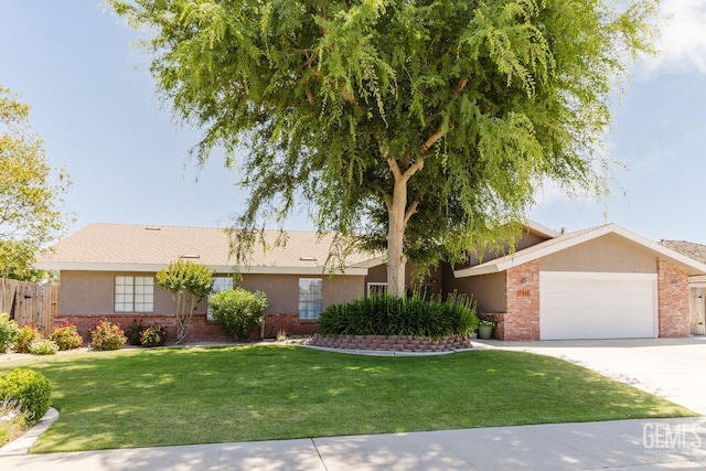 7116 Jolynn St, Bakersfield, CA 93308 - ranch-style home with brick siding, an attached garage, driveway, and stucco siding