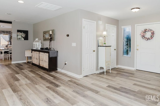 7116 Jolynn St, Bakersfield, CA 93308 - foyer entrance with light wood-style flooring and baseboards