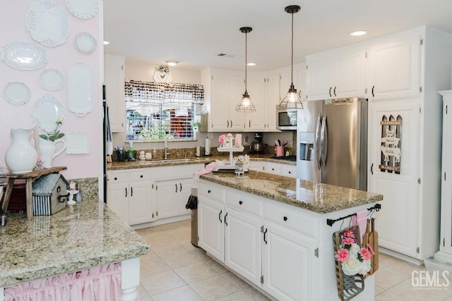 7116 Jolynn St, Bakersfield, CA 93308 - kitchen with a sink, stainless steel appliances, light tile patterned floors, light stone countertops, and recessed lighting