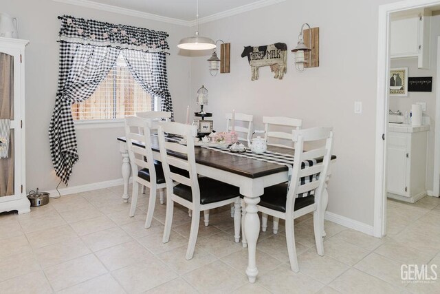 7116 Jolynn St, Bakersfield, CA 93308 - dining area with crown molding, baseboards, and light tile patterned floors