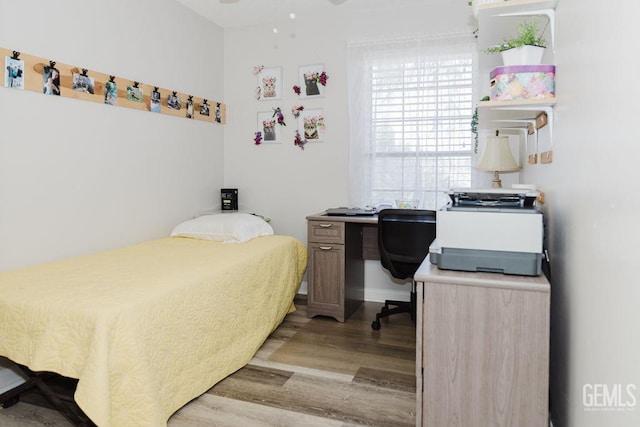 7116 Jolynn St, Bakersfield, CA 93308 - bedroom with light wood-style floors and a desk
