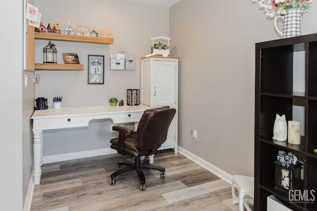 7116 Jolynn St, Bakersfield, CA 93308 - office area featuring wood finished floors and baseboards