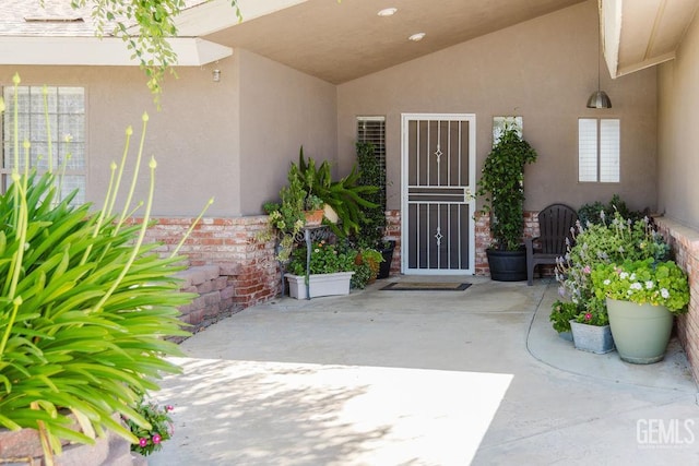 7116 Jolynn St, Bakersfield, CA 93308 - view of exterior entry with a patio and stucco siding