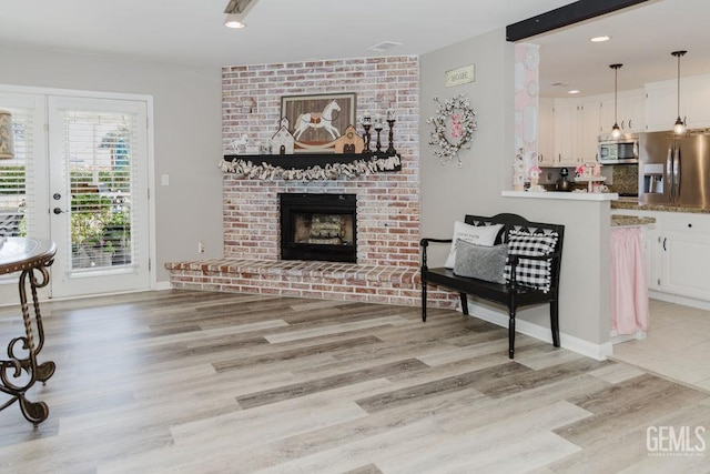 7116 Jolynn St, Bakersfield, CA 93308 - living room with a fireplace, light wood finished floors, and recessed lighting