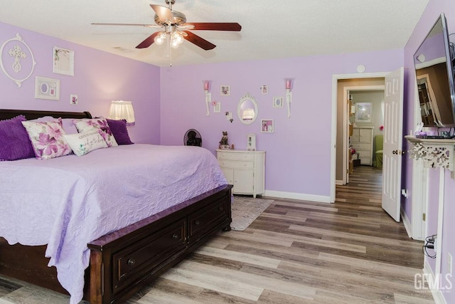 7116 Jolynn St, Bakersfield, CA 93308 - bedroom with light wood-type flooring, baseboards, and a ceiling fan