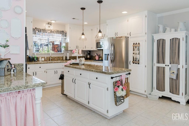 7116 Jolynn St, Bakersfield, CA 93308 - kitchen with a sink, stainless steel appliances, stone countertops, a center island, and white cabinets