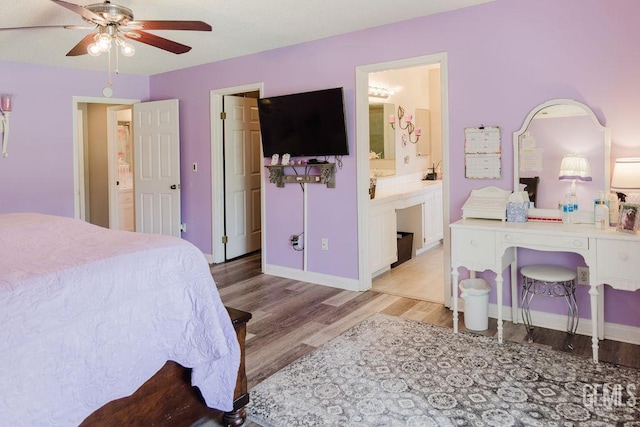 7116 Jolynn St, Bakersfield, CA 93308 - bedroom featuring light wood-style floors, ensuite bath, baseboards, and ceiling fan