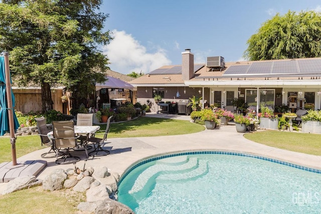 7116 Jolynn St, Bakersfield, CA 93308 - swimming pool featuring a patio area, outdoor dining space, french doors, and cooling unit
