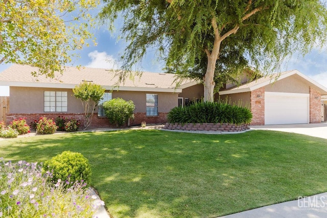 7116 Jolynn St, Bakersfield, CA 93308 - single story home featuring brick siding, a front lawn, a garage, driveway, and stucco siding