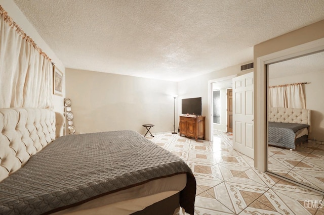 bedroom with a textured ceiling