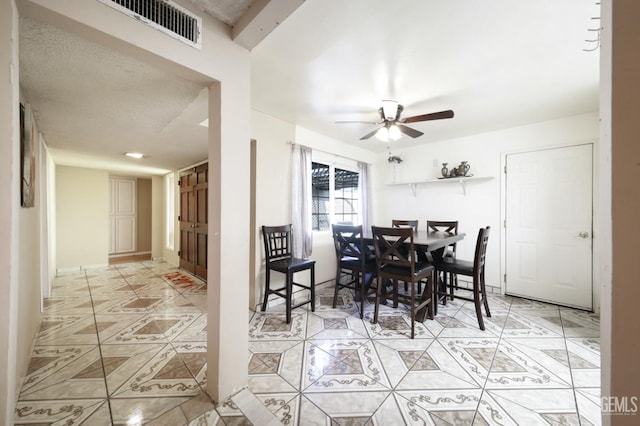 dining space with ceiling fan