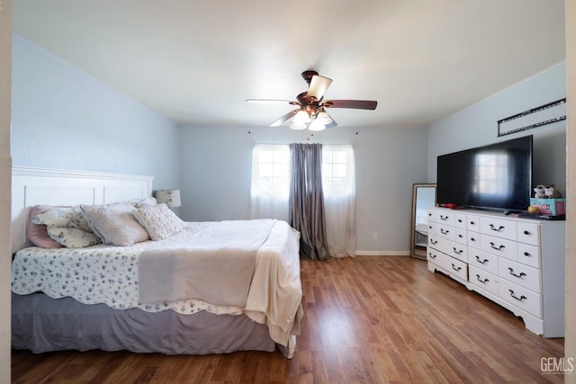 bedroom featuring ceiling fan and hardwood / wood-style floors