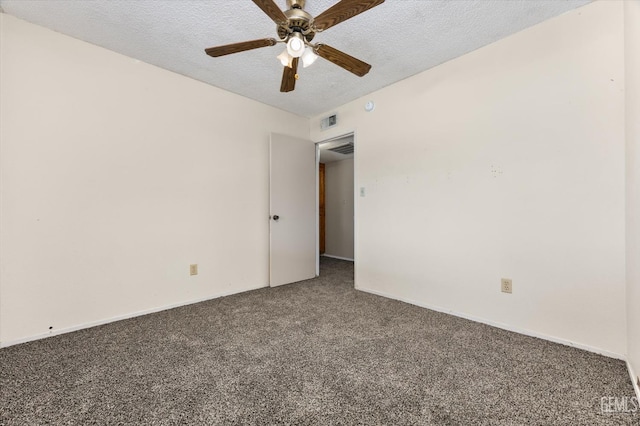 empty room with visible vents, a textured ceiling, carpet floors, baseboards, and ceiling fan