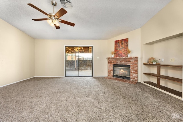 unfurnished living room featuring visible vents, a textured ceiling, a fireplace, carpet flooring, and lofted ceiling