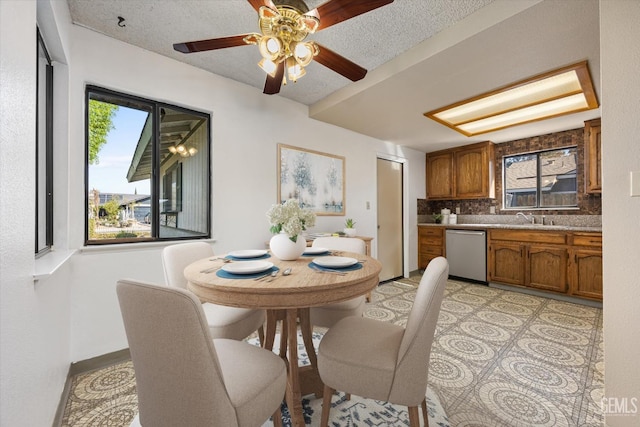 dining space featuring plenty of natural light and a textured ceiling