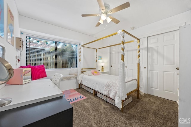 carpeted bedroom with a ceiling fan and multiple closets