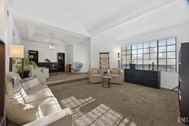 living area featuring carpet floors, a raised ceiling, and vaulted ceiling