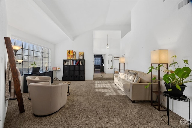 carpeted living room featuring high vaulted ceiling and visible vents